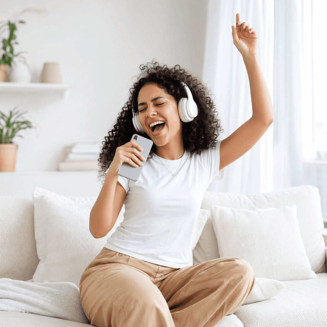 Professional vocalist recording vocals with studio microphone and pop filter